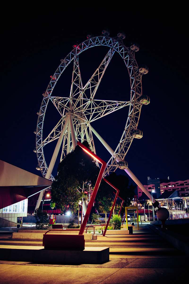 amusement park low angle photo of white and red ferris wheel leisure activities